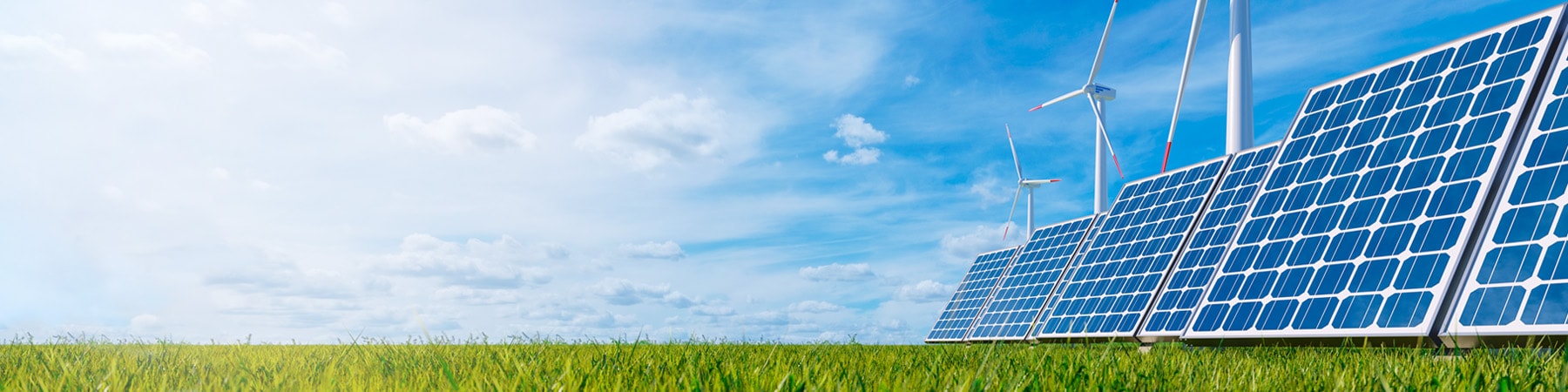Windkraftanlagen Solarpanelen auf einer Wiese